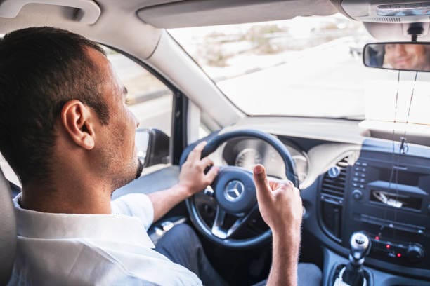 a man driving a car
